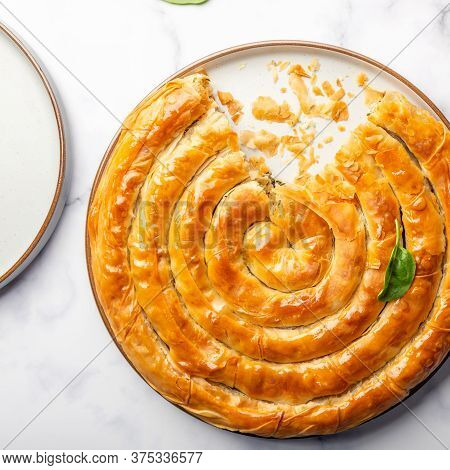 Filo Spinach And Feta Twist Pie In The Iron Pan After Oven. Authentic Greek Bakery. With Spinach, Mi