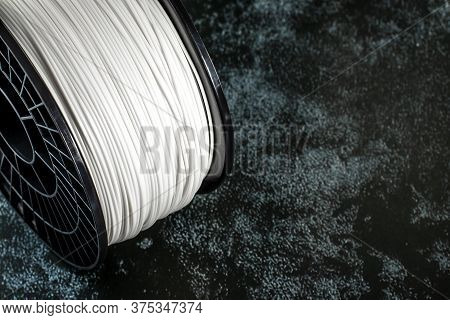Filament For 3d Printing. Bright Thermoplastic Of White Color. Reel Vertical View. Macro