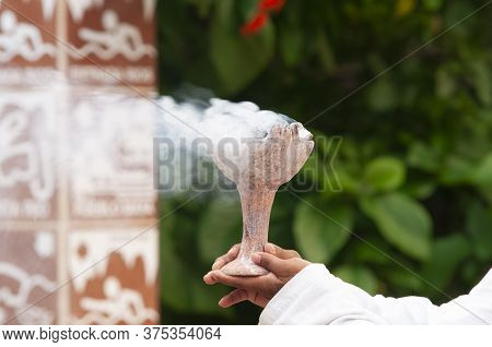 Young Mayan Man Holds In His Hands A Brazier Lit With Copal Smoke - Ancient Mayan Tradition Of Purif