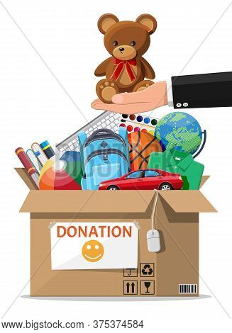 Cardboard Donation Box Full Of Toys, Books, Clothes And Devices. Help For Children, Support For Poor