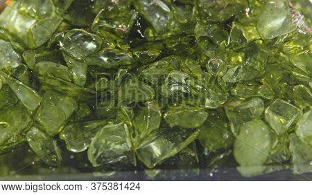 Green Peridot Stones Inside Plastic Resin Close Up