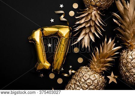 17th Birthday Celebration Background With Gold Balloons And Golden Pineapples