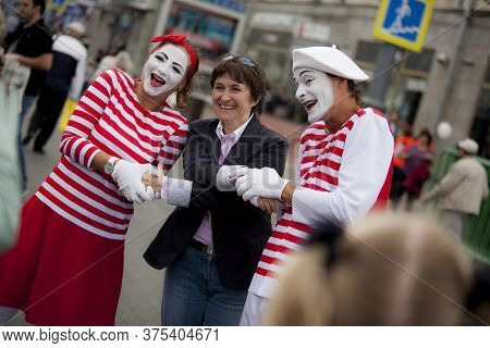 9 September 2014. Moscow, Russia. Two People With Pantomime Makeup And Happy Woman. Moscow Day. Edit