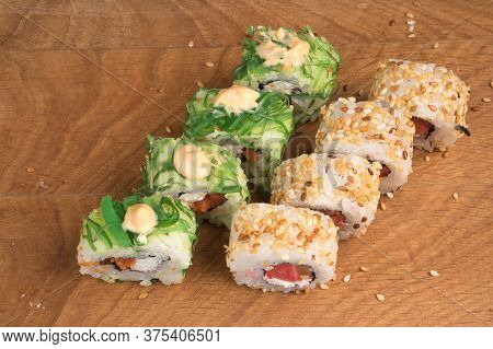 Sushi Rolls On A Wooden Board Delicious Food