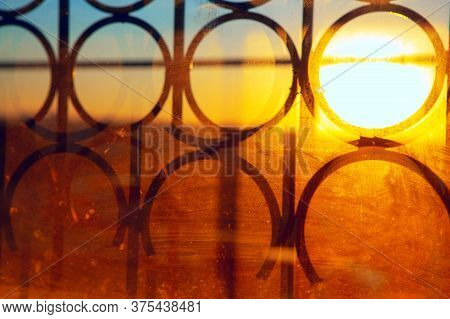Sunlight In Window With Grates . Dirty Window Glass With Light Beam