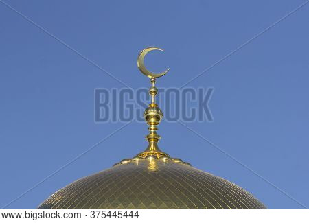 Muslim Mosque On A Background Of Blue Sky. Muslim And Islamic Architecture