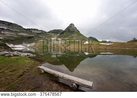Lake In The Austrian Alps With Reflection From Mountain In The Water. Augstsee. Loser. Austria