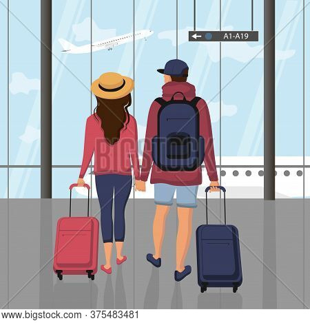 Young Happy Family Going On Vacation, Couple Of Travelers Carrying A Luggage At The Airport