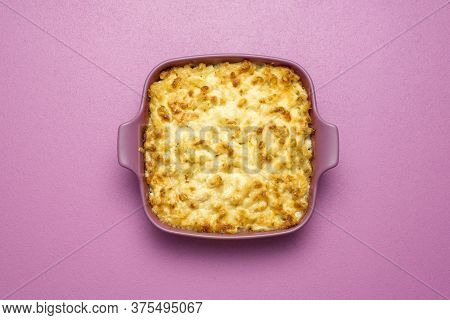 Top View With A Pink Tray With Mac And Cheese Baked With White Sauce. Freshly Baked Macaroni And Che