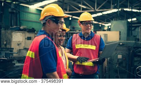 Scene Of Inspectors Team Asking Information With Woman Worker And Checking The Safety And Review The