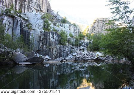 Small Natural Lake Inside A Marble Quarry In Mountain In Apuan Alps