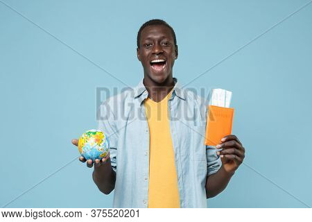 Excited Young African American Man Guy In Casual Shirt Yellow T-shirt Isolated On Blue Wall Backgrou