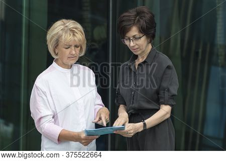 Strict Displeased Lady Boss Checking The Report Of A Subordinate Employee, Worker, Show What Needs T