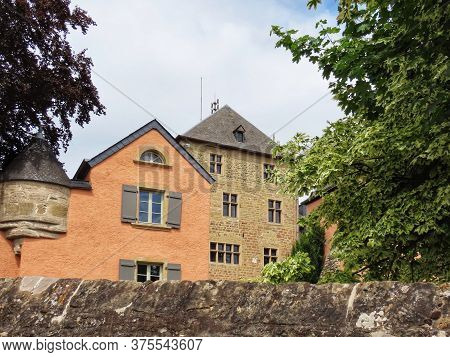 Mersch Castle In Luxembourg, Today Used As City Hall. Seen From Outside On Sunny Summer Day