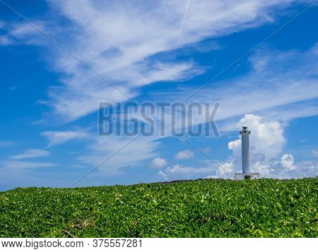 Cape Zanpa Lighthouse, A Tourist Spot In Okinawa With A Refreshing Blue Sky In Summer