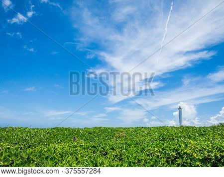 Cape Zanpa Lighthouse, A Tourist Spot In Okinawa With A Refreshing Blue Sky In Summer