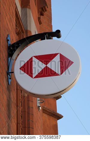 A Hsbc Bank Sign Hanging Above A Branch In The Uk, Taken On 22nd June 2020