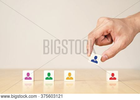 Asian Businessman's Hand With Wooden Concept Of Re-organized And Skill Of Employee Structure, Recrui