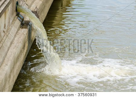 Flow Out Water From The Conduit To The River
