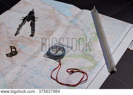 Map With Measuring Tools, Pencil, Compass, Dividers, Magnifying Glass Depicting Planning Concept