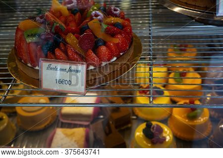 Hossegor, France. 27.06.2020. Delicious Fruits Cakes In A Bakery Shop Window. Colorful Closeup On A 