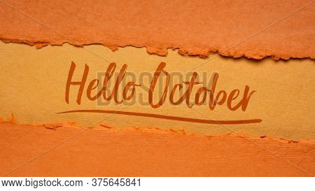 Hello October welcome note  - handwriting on a handmade rag paper in pumpkin orange tones