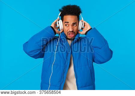 Cringing And Bothered African-american Man Grimacing Hearing Bad Sound Quality Of Headphones, Dont L
