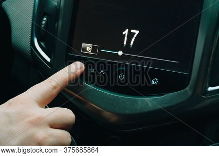 The Man Turns The Sound Up And Down In The Car