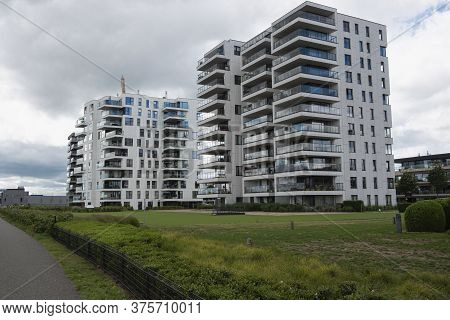 Temse, Belgium, July 05, 2020, Two Residential Apartments And A Towpath In The Belgian Municipality 