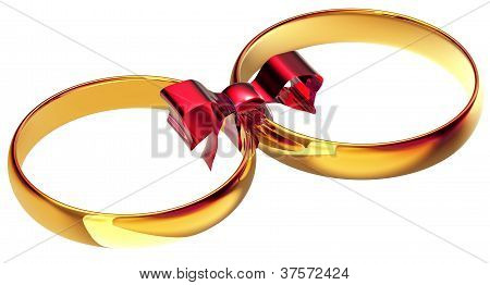 anéis de casamento de ouro com o laço de seda