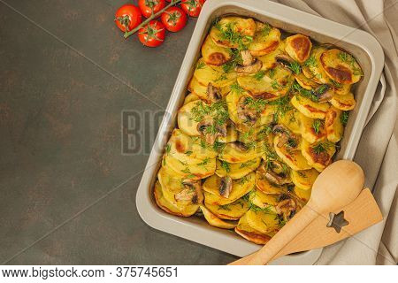 Potato Wedges Baked With Mushrooms, Herb Oven Roasted, With Thyme, A Close-up In A Baking Tray. Top 