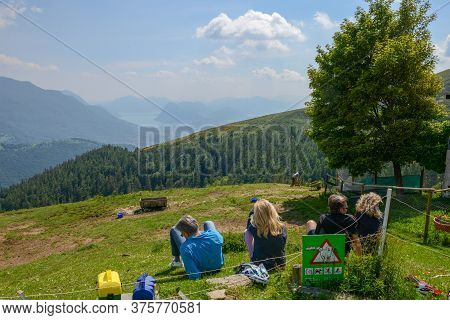People Eating On A Restaurant On Capriasca Valley Over Lugano On Switzerland