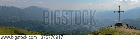 People At Cross Of Motto On Capriasca Velley Over Lugano In Switzerland