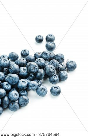 Tasty Blueberries Fruit Are Scattered On A White Background.