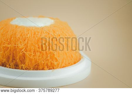 Egg Thread Cake (fios De Ovos) Topped With Creamy Coconut Whipped Cream. Thai Dessert Style