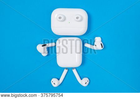 Rostov, Russia - July 06, 2020: Funny Little Man With Arms, Legs And Eyes Made Of Apple Wireless Hea