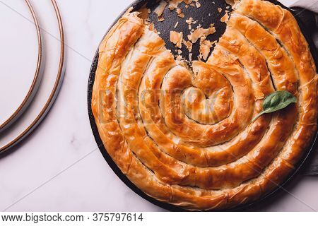Filo Spinach And Feta Twist Pie In The Iron Pan After Oven. Authentic Greek Bakery. With Spinach, Mi