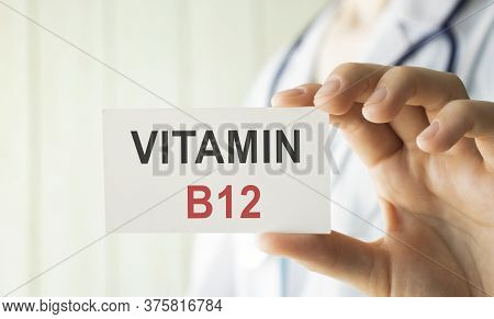 Doctor Holding A Card With Vitamin B12, Medical Concept
