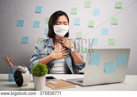 Asian Woman Wearing Protective Face Mask Was Sick With Sore Throat At Home Office. Wfh. Work From Ho