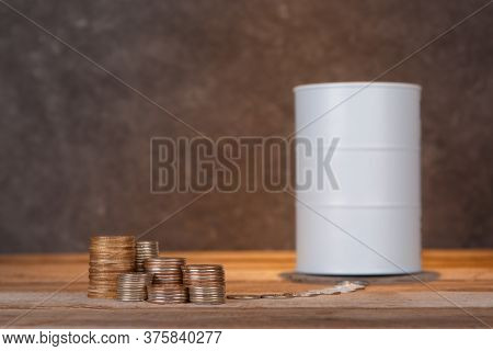 Investing In Oil. Barrel Of Oil And Coins