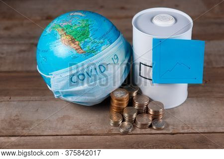 Financial Crisis Of Oil On The Planet Associated With The Epidemic. Globe With A Bandage And A Barre