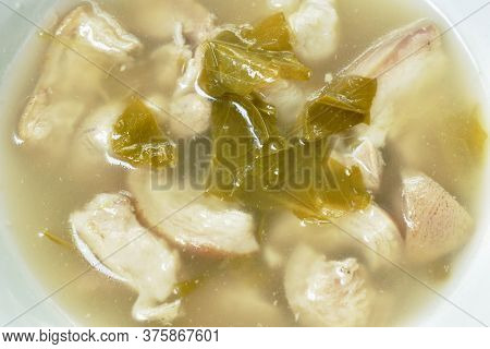 Boiled Pork Leg And Belly With Cowa Leaf Soup On Bowl