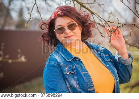 Mature Plus Size Woman, American Or European Appearance Walks And The  Enjoying Life. Lady With Exce