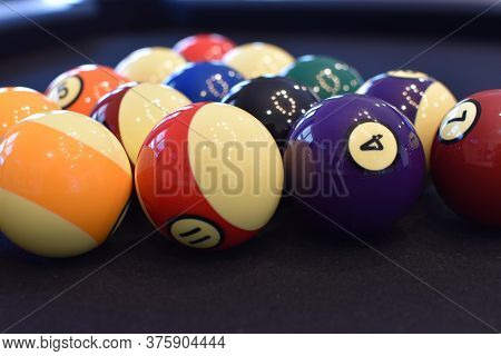 Black Billiard Table, Playing Snooker Pool 8Ball - Close-up Shot Of A Man Playing Billiard