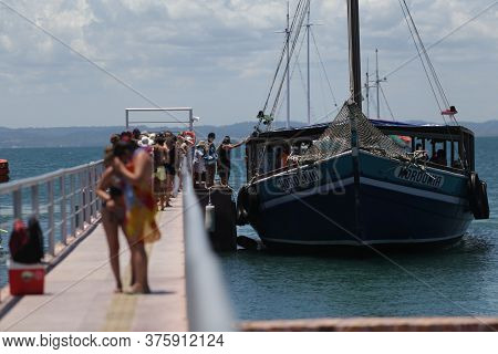 Salvador, Bahia / Brazil  - January 31, 2019: Passengers Are Seen At The Pier Of Ilha Dos Frades Sch