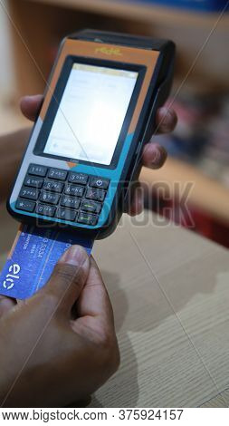 Salvador, Bahia / Brazil - November 22, 2019: Person Uses Credit Card Machine In Shoppng Shop In The