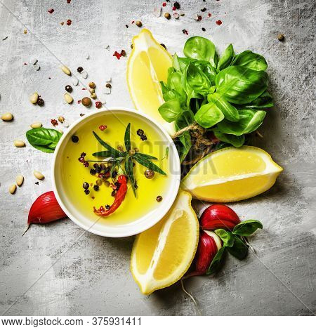 Salad Dressing With Basil, Olive Oil, Garlic, Lemon And Spices, Top View, Food Background