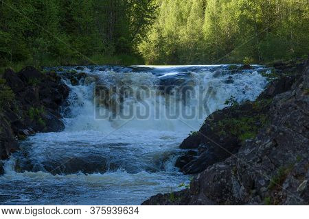 At Kivach Waterfall On A June Evening. Karelia, Russia