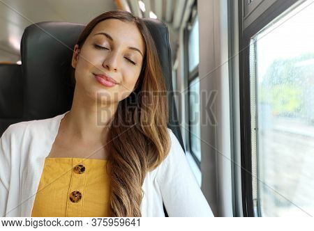 Tired Business Woman Sleeping Sitting In The Train After A Day Of Work . Train Passenger Traveling S