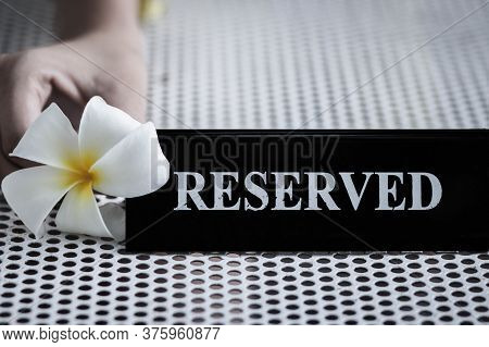 Reserved Metal Black Plate In A Restaurant. Reserved Metal Plate On The White Table. Vintage Photo P
